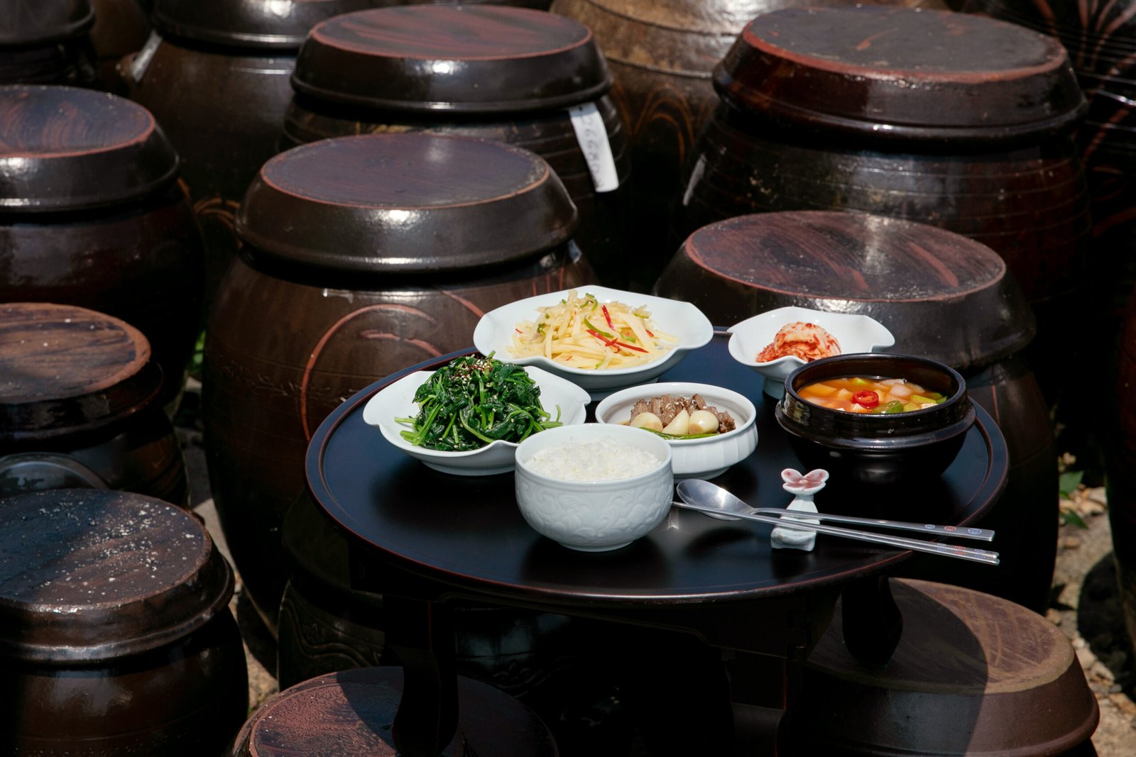 A spread of small dishes of Korean seasoned vegetable side dishes