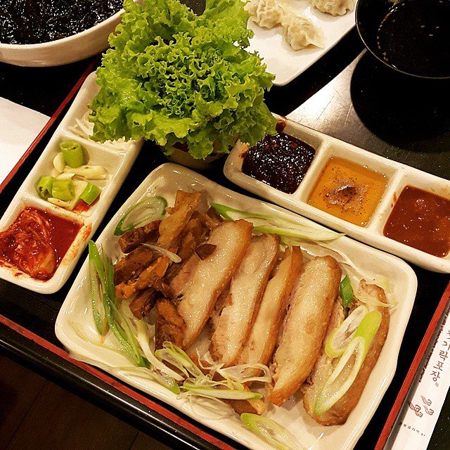 Close-up of boiled pork belly slices showing the layered fat and meat