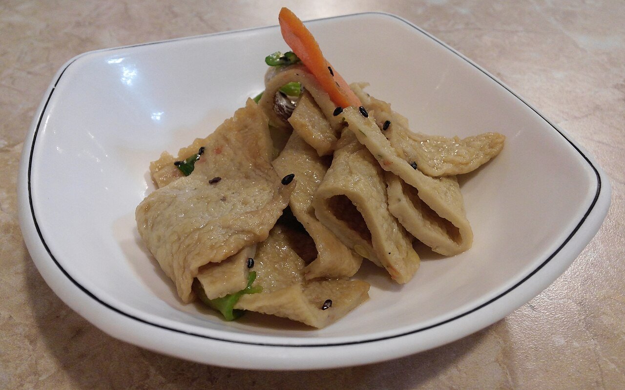A pan of stir-fried Korean fish cake strips, eomuk bokkeum, in a red sauce