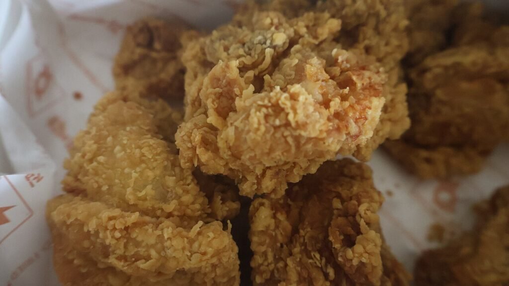 Crispy double-fried Korean chicken pieces piled on a plate