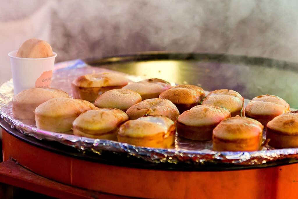 A whole gyeranppang, Korean egg bread, with a baked egg visible on top, photographed as Seoul street food