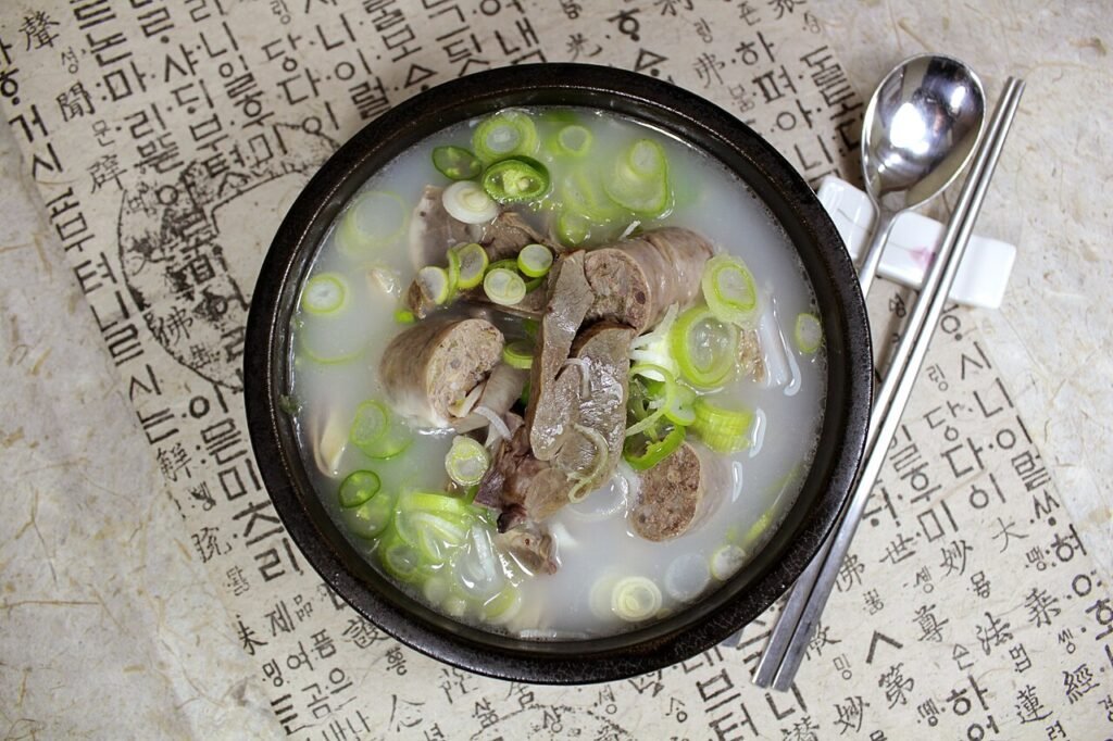 A bowl of haejangguk, Korean hangover soup, with napa cabbage in a beef broth