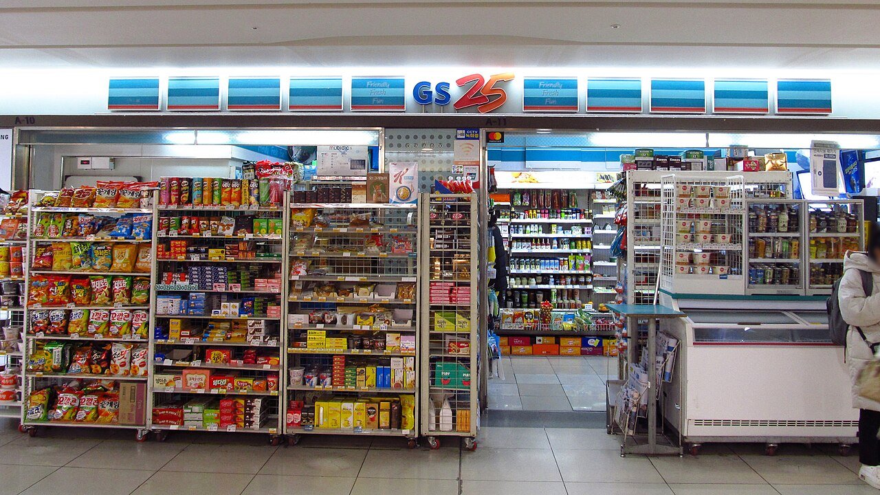 The lit storefront of a GS25 convenience store branch inside Gangnam station in Seoul
