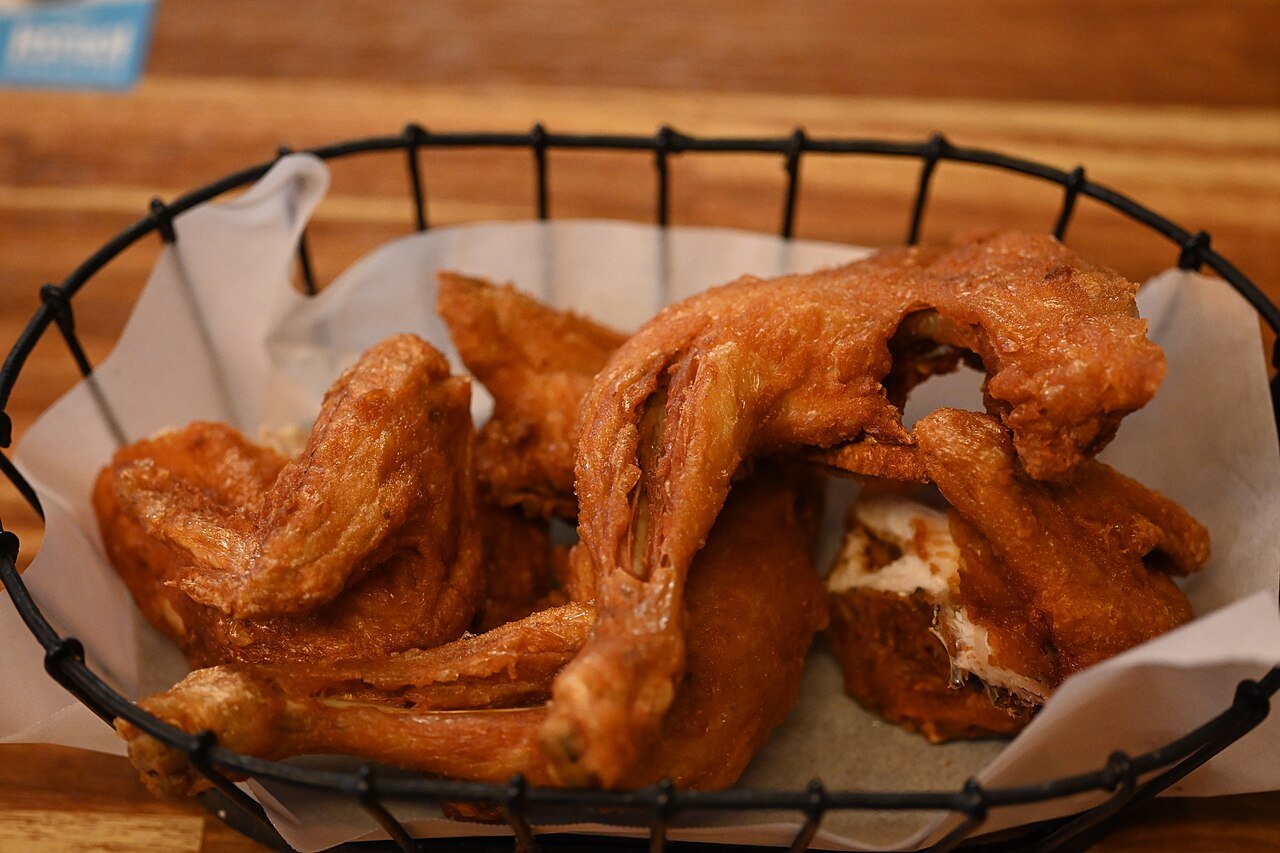 Old-style Korean fried chicken, bone-in pieces with a thin pale-gold crust