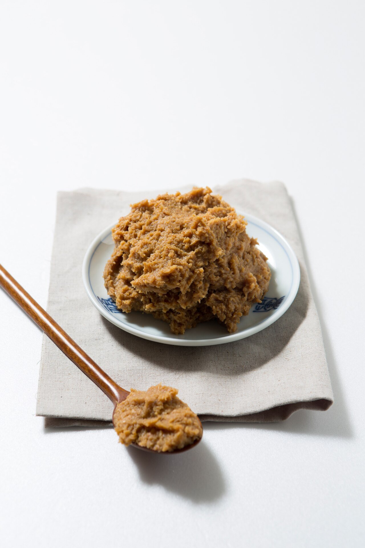 Brown Korean fermented soybean paste, doenjang, in a bowl
