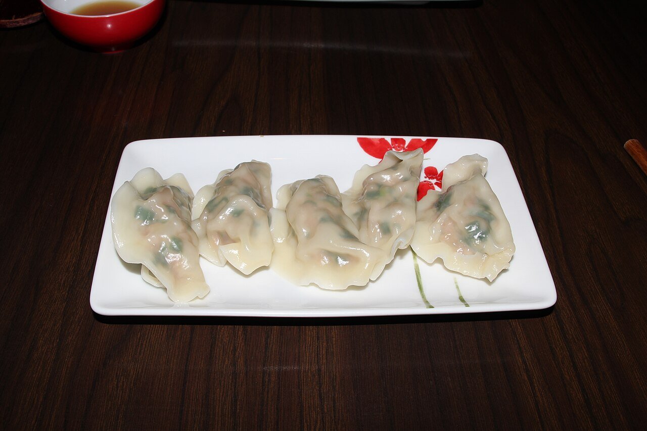 A plate of Korean mandu dumplings before being added to broth