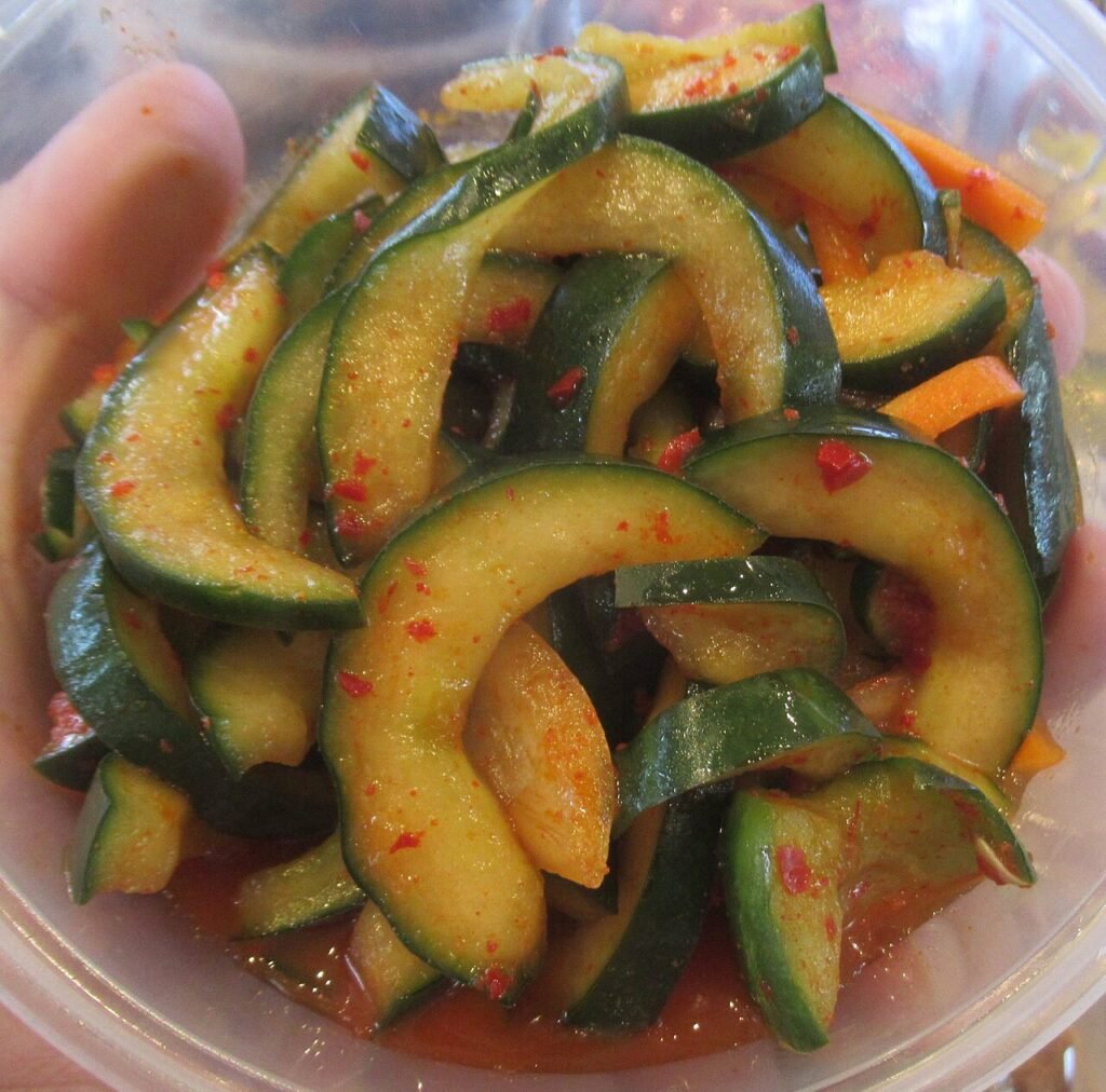 A plate of spicy Korean cucumber salad, oi muchim, in red gochugaru dressing