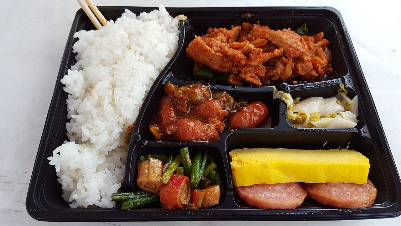 Packaged Korean convenience-store meals and snacks displayed on a refrigerated shelf