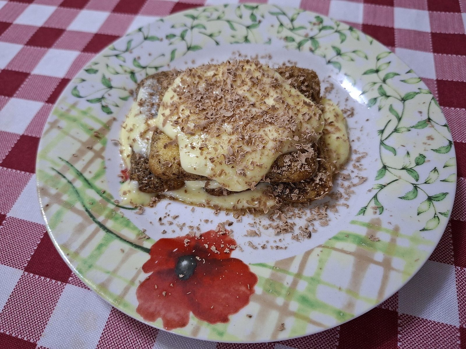 Individual portion of tiramisu dusted with cocoa