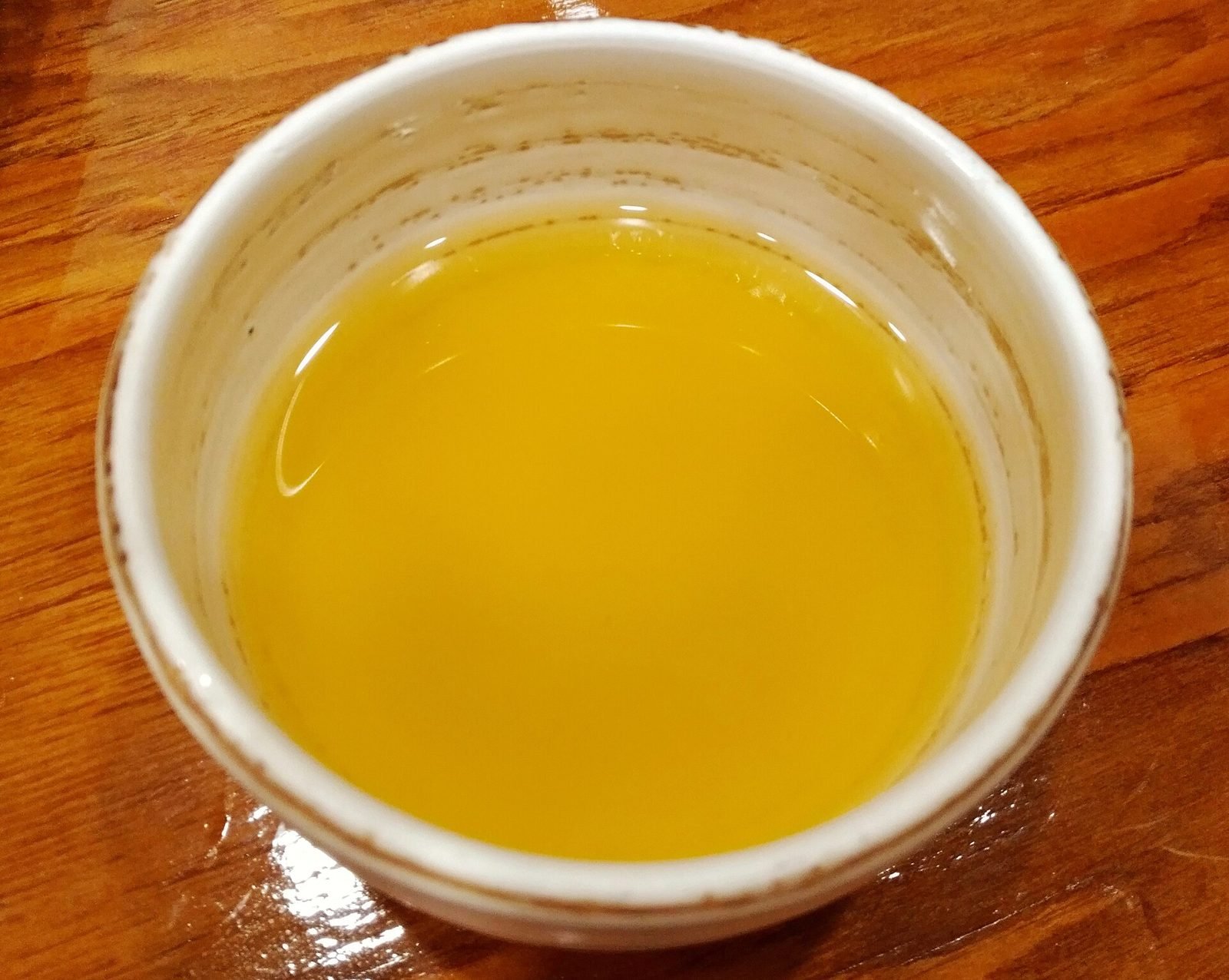 Cup of golden yellow pumpkin sikhye