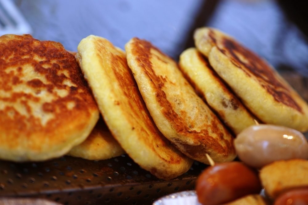 Stack of golden pan-fried hotteok pancakes