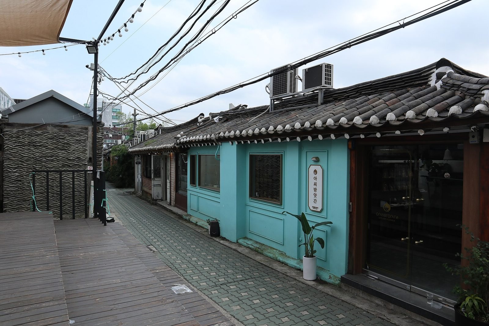 Narrow alley lined with small hanok houses in Ikseon-dong